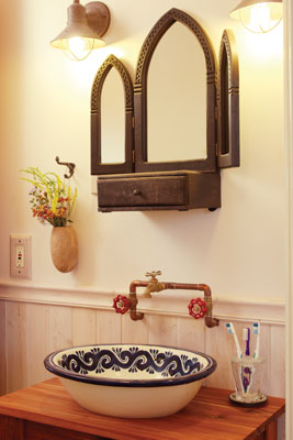 A bowl from Chihuahua, Mexico serves as a sink in the bathroom. The mirror is one of Emmanuelle’s many unique contributions to the home.